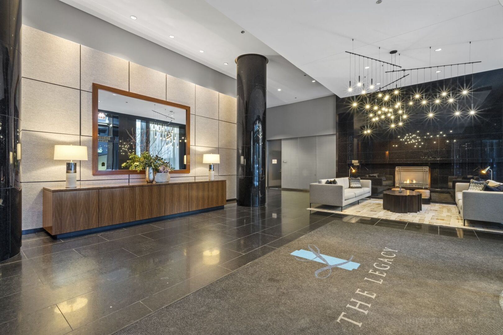 60 East Monroe Street, Unit 1604 Chicago, IL 60603 - Photo 26 of 34 a living room with furniture a rug kitchen view and a large window