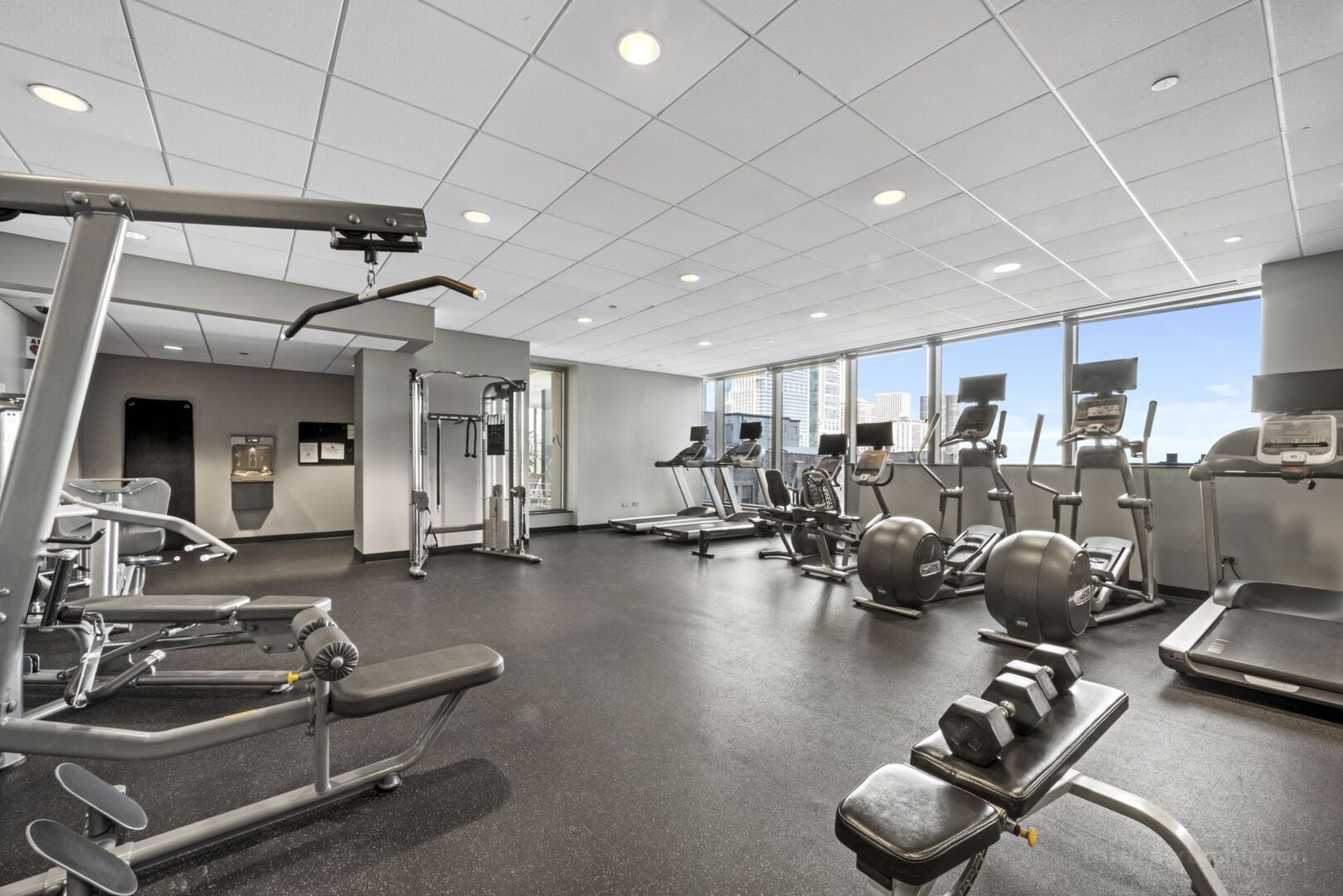 60 East Monroe Street, Unit 1604 Chicago, IL 60603 - Photo 30 of 34 a room with gym equipment and lots of equipment