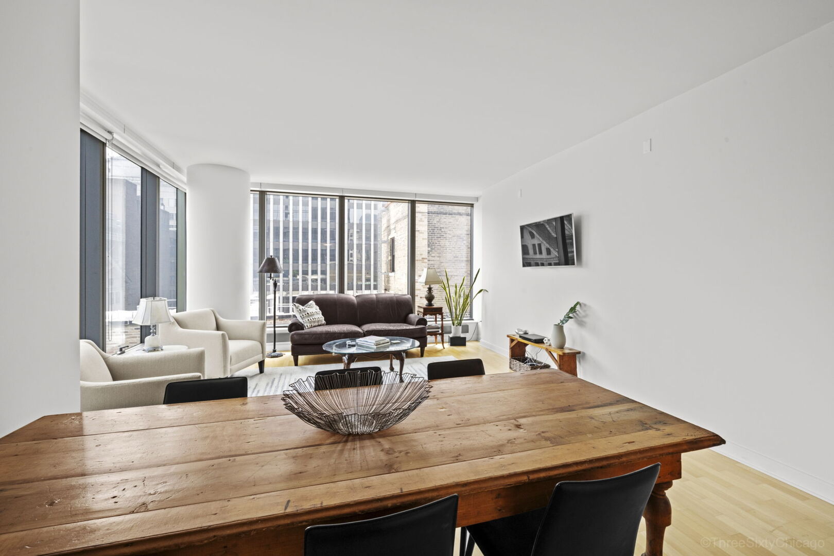 60 East Monroe Street, Unit 1604 Chicago, IL 60603 - Photo 9 of 34 a view of living room filled with furniture and wooden floor