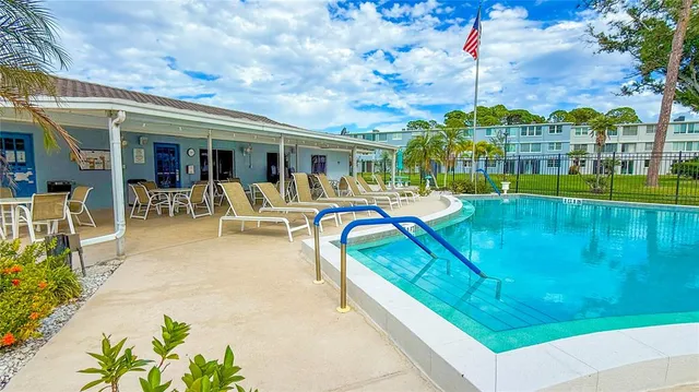 a view of a patio with couches table and chairs and potted plants