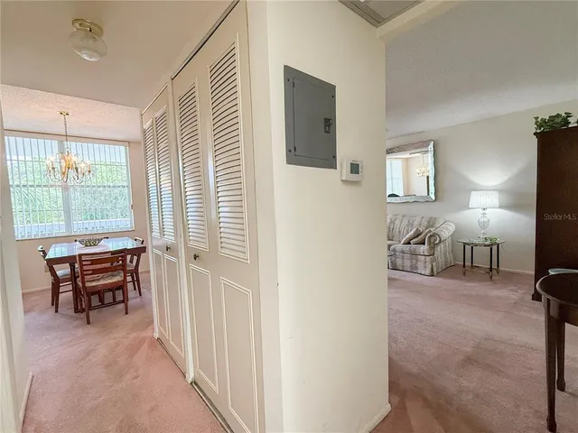 a view of a livingroom with furniture and windows