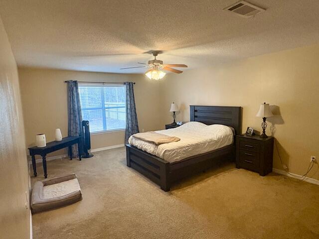 3012 Crown Creek Circle Crestview, FL 32539 - Photo 11 of 22 a bedroom with a bed and a table in it