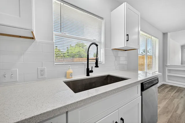 a kitchen with a sink and a window