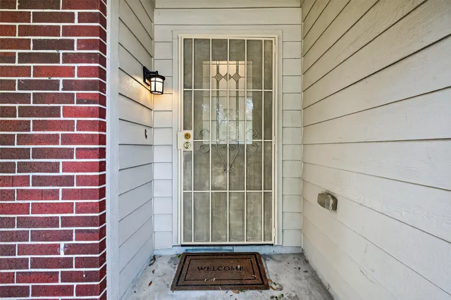 a view of a door and a window