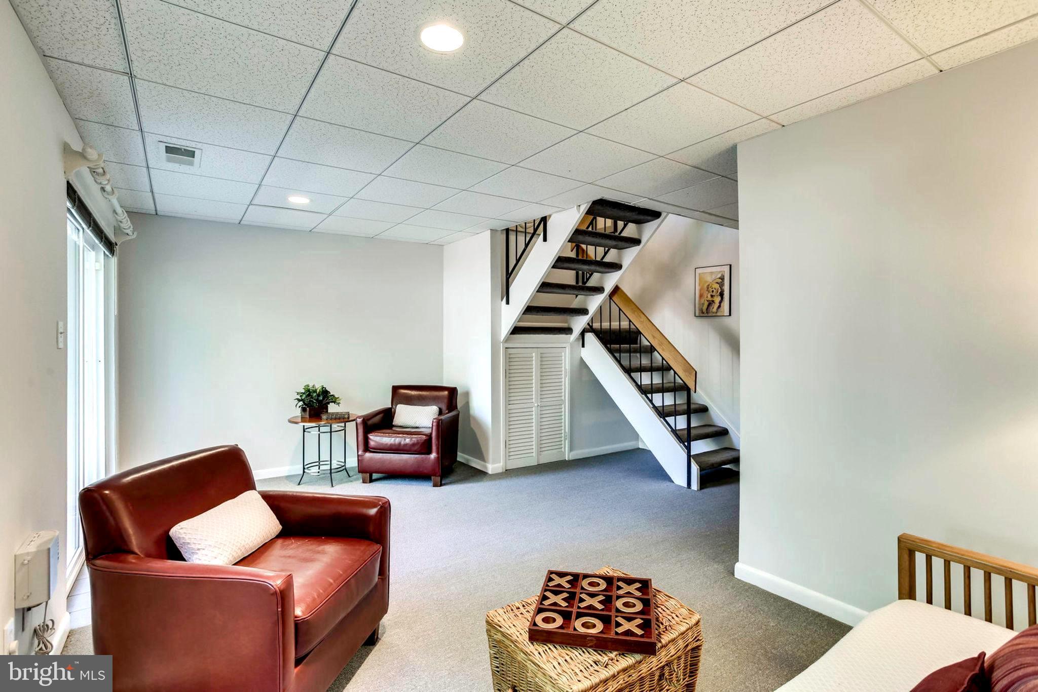 2239 Southgate Square Reston, VA 20191 - Photo 15 of 50 Stairs down to lower-level family room