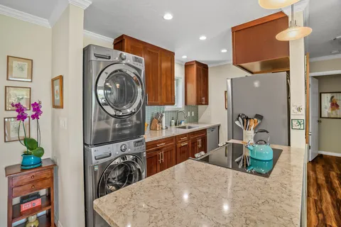 a view of a kitchen and utility room