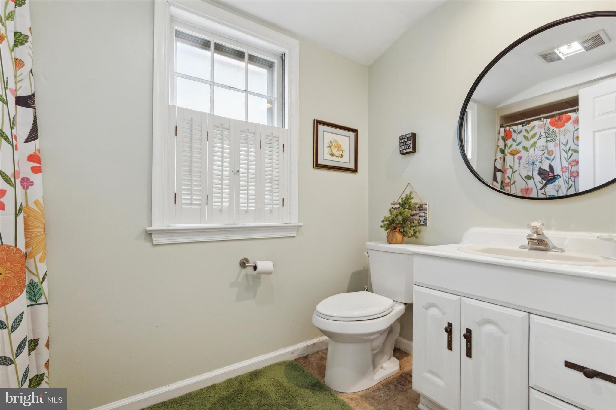 629 Colonel Dewees Road Wayne, PA 19087 - Photo 25 of 34 a bathroom with a toilet sink and mirror