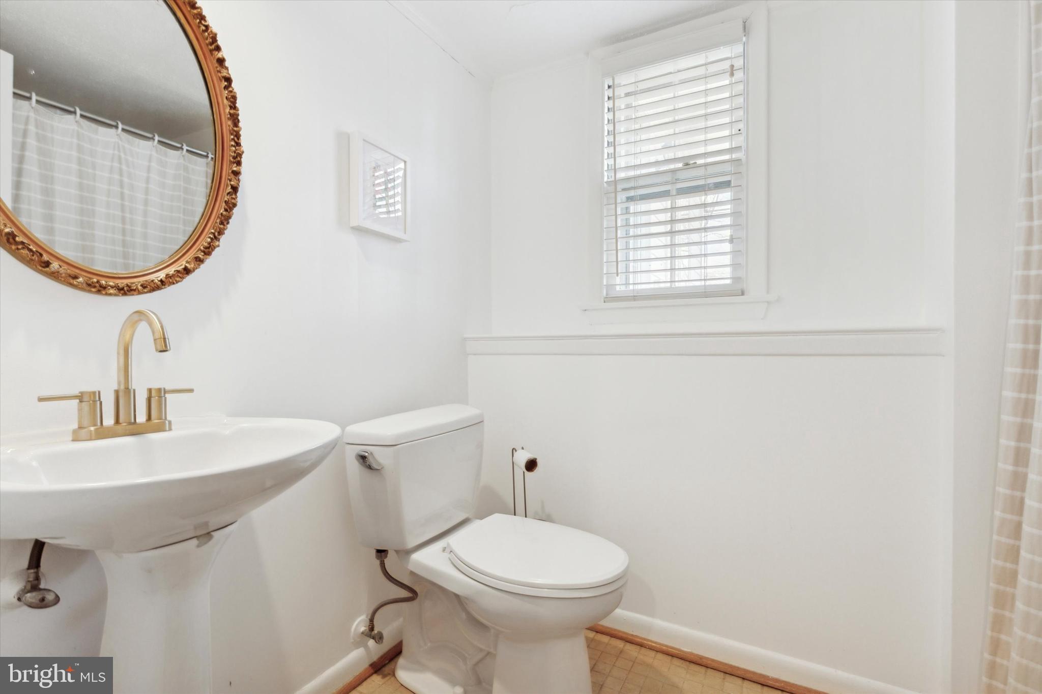629 Colonel Dewees Road Wayne, PA 19087 - Photo 31 of 34 a bathroom with a sink toilet and a mirror