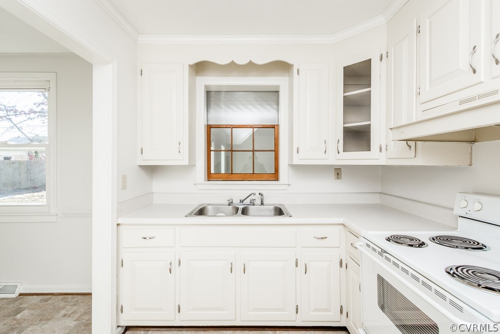 6752 Strathmore Road Richmond, VA 23237 - Photo 9 of 33 Nice bright kitchen that has a look through into t