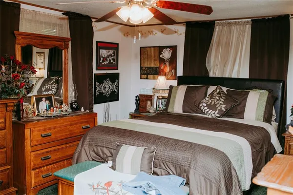 a kitchen with stainless steel appliances granite countertop a stove top oven a sink and dishwasher with wooden floor