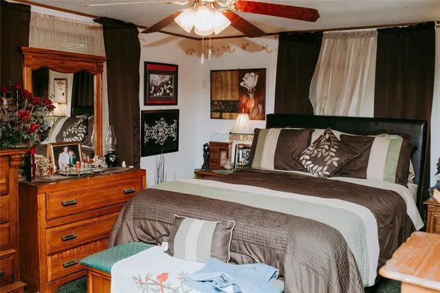 a kitchen with stainless steel appliances granite countertop a stove top oven a sink and dishwasher with wooden floor