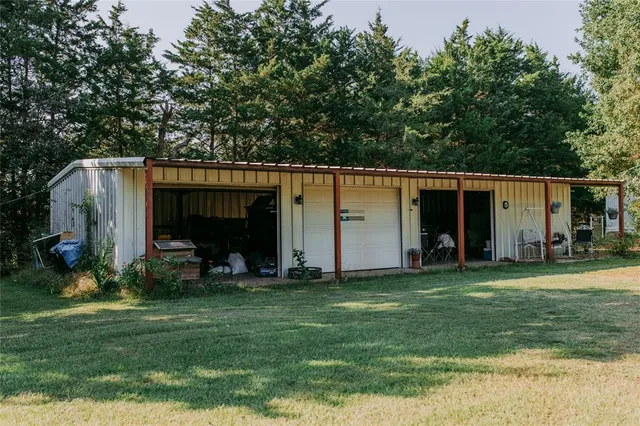 a kitchen with a table and chairs in it