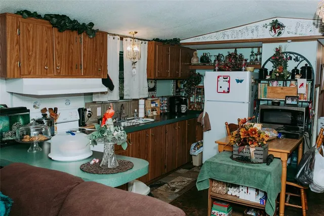 a living room with furniture and flowers