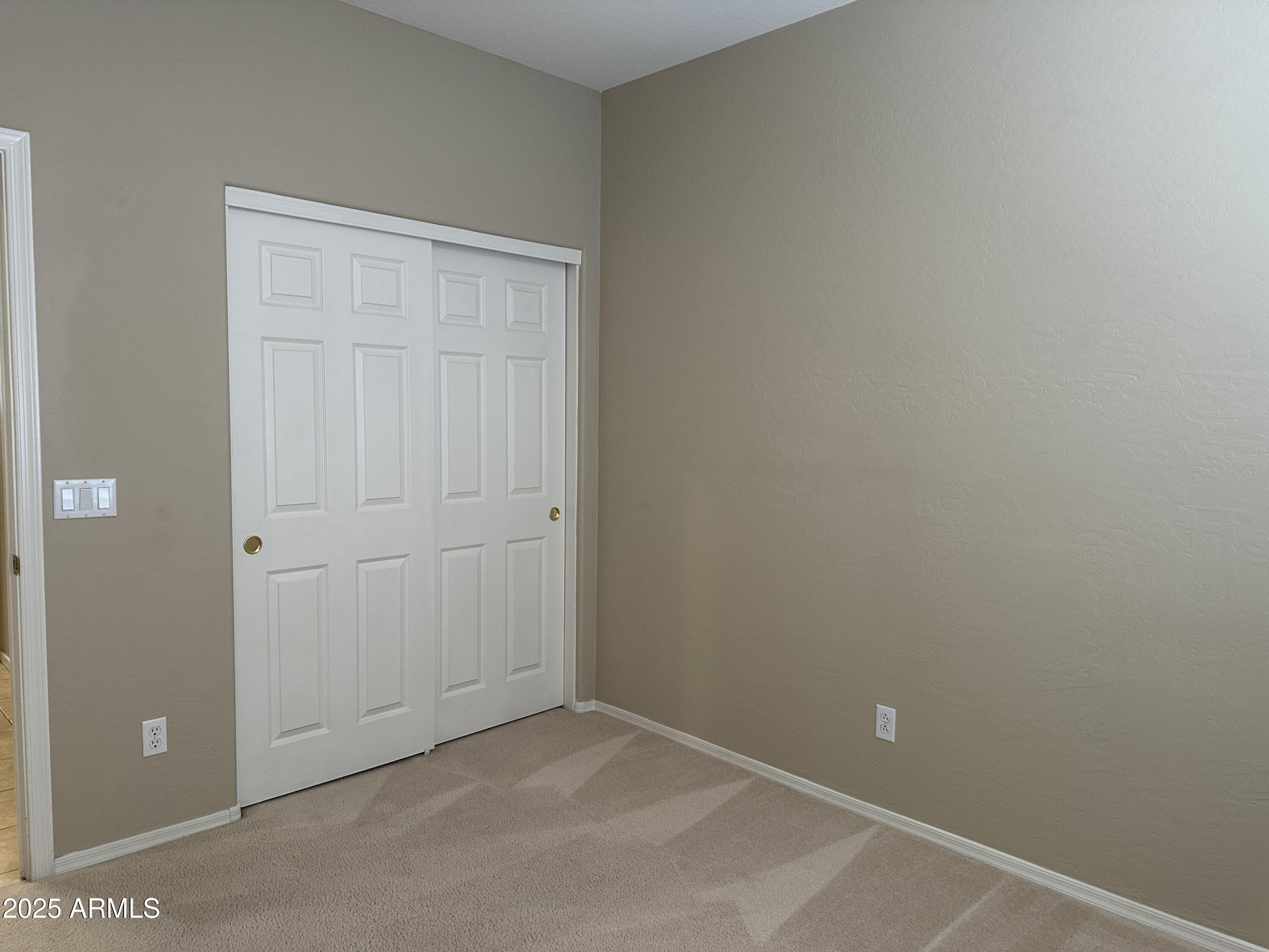 10460 South 182nd Drive Goodyear, AZ 85338 - Photo 11 of 33 an empty room with closet area