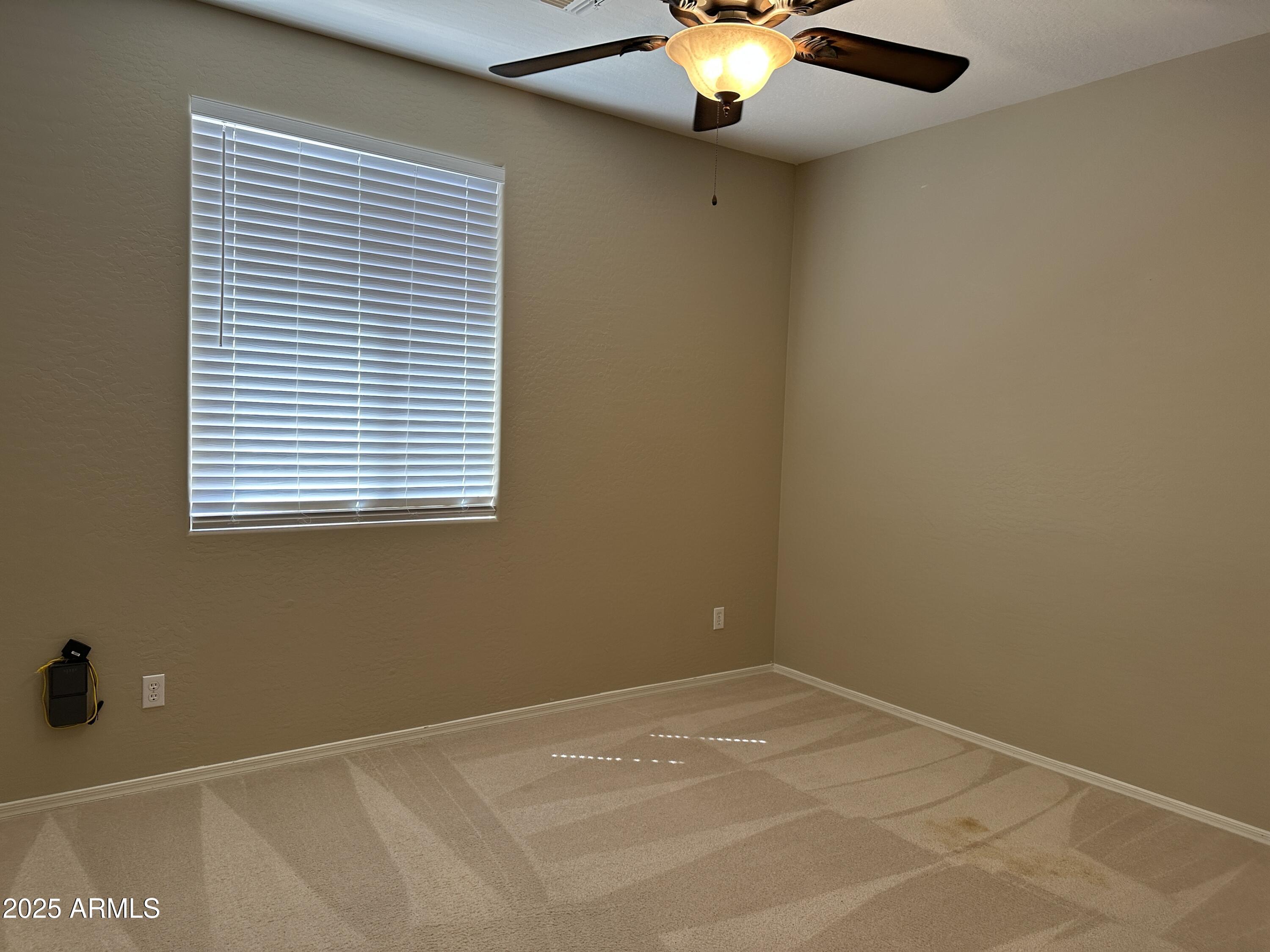 10460 South 182nd Drive Goodyear, AZ 85338 - Photo 14 of 33 an empty room with a window