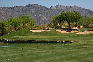 10460 South 182nd Drive Goodyear, AZ 85338 - Photo 25 of 33 a view of a lake with a mountain in the background