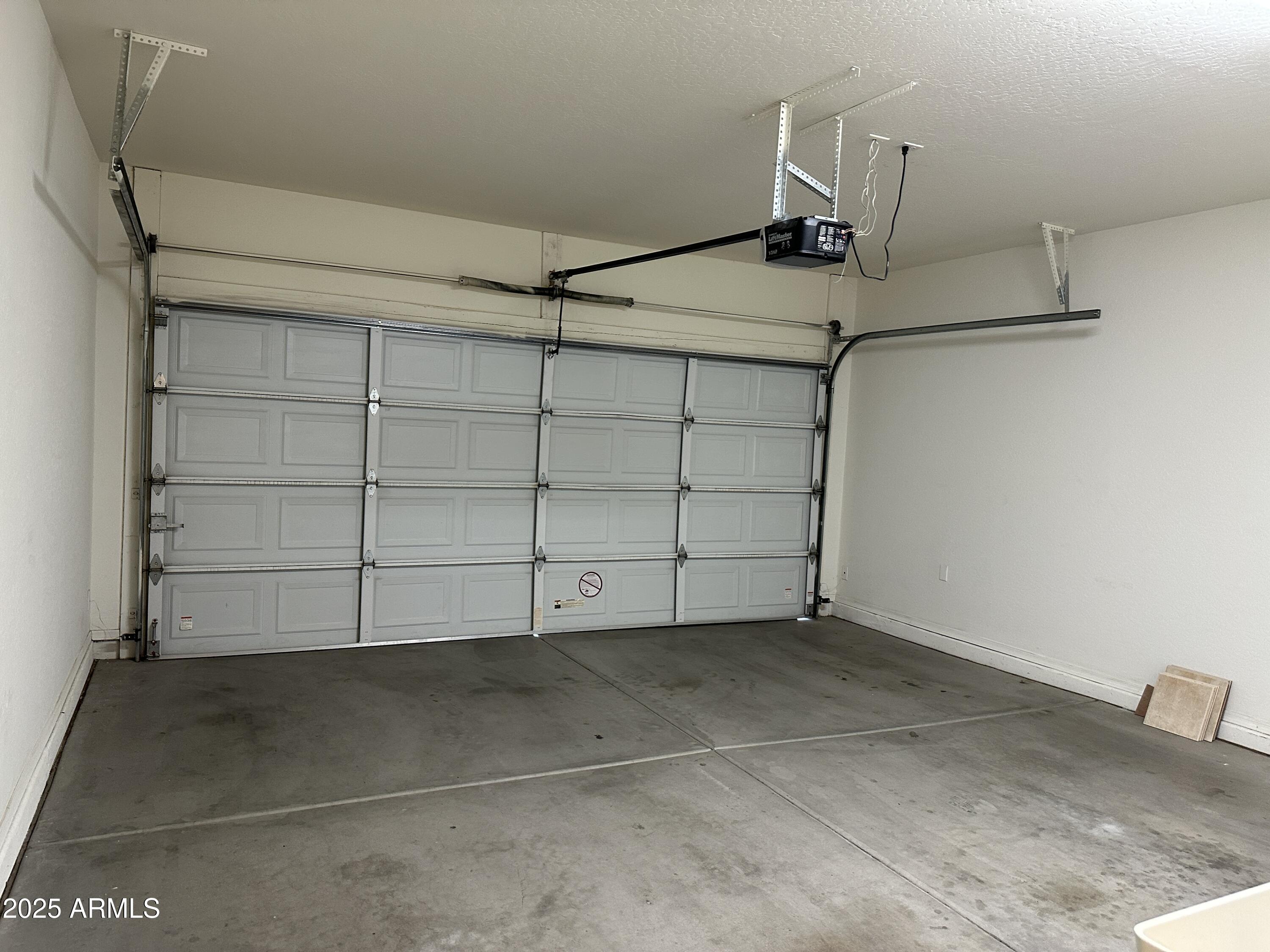 10460 South 182nd Drive Goodyear, AZ 85338 - Photo 31 of 33 a view of a room with racks on the wall
