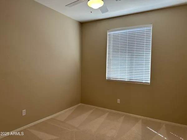 an empty room with closet area