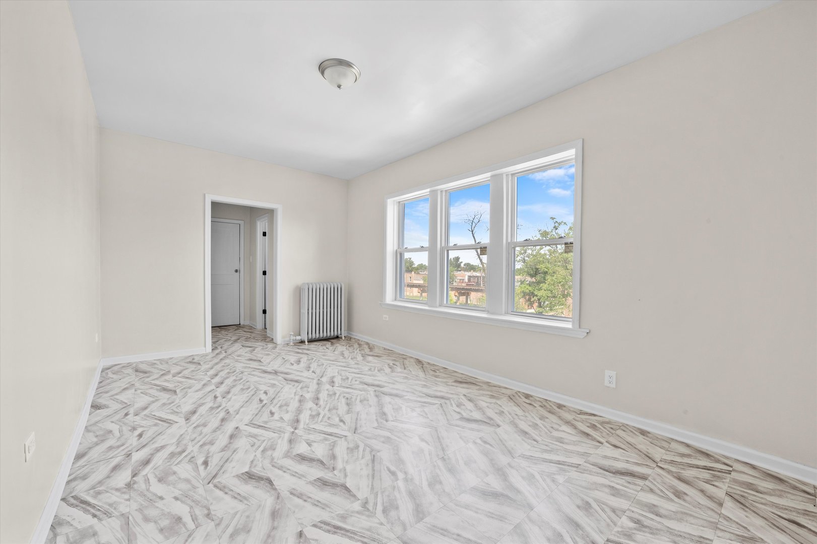 3349 West 21st Street Chicago, IL 60623 - Photo 12 of 14 a view of an empty room with a window