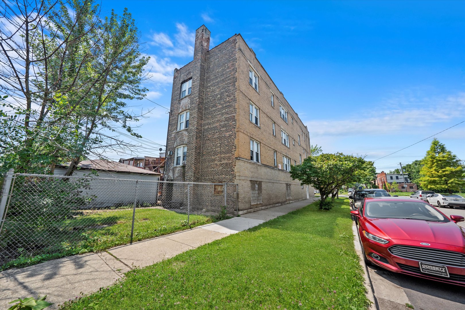 3349 West 21st Street Chicago, IL 60623 - Photo 2 of 14 a view of a yard in front of a brick building