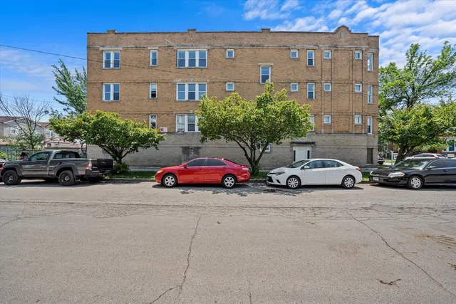 a view of a cars parked in front of a building