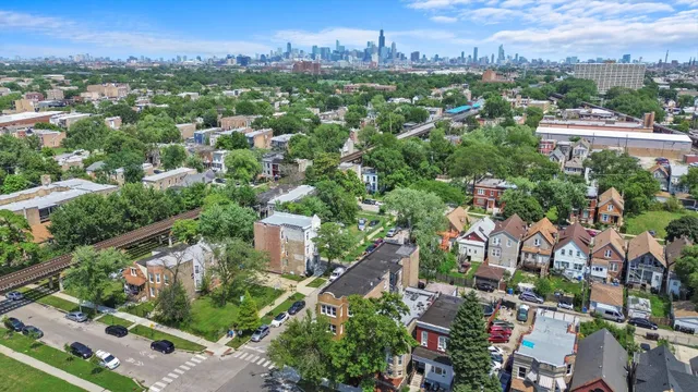 an aerial view of a city with lots of residential buildings