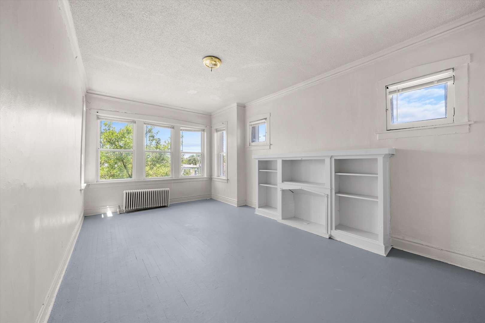 3349 West 21st Street Chicago, IL 60623 - Photo 7 of 14 an empty room with a window and cabinet