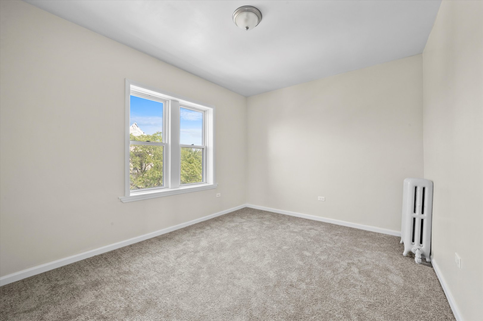 3349 West 21st Street Chicago, IL 60623 - Photo 10 of 14 an empty room with a window
