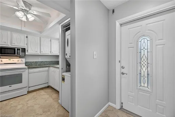 a kitchen with a refrigerator stove and microwave