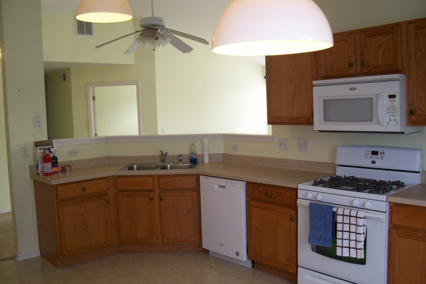 523 North Red Deer Road Round Lake, IL 60073 - Photo 5 of 14 a kitchen with a sink stove and cabinets