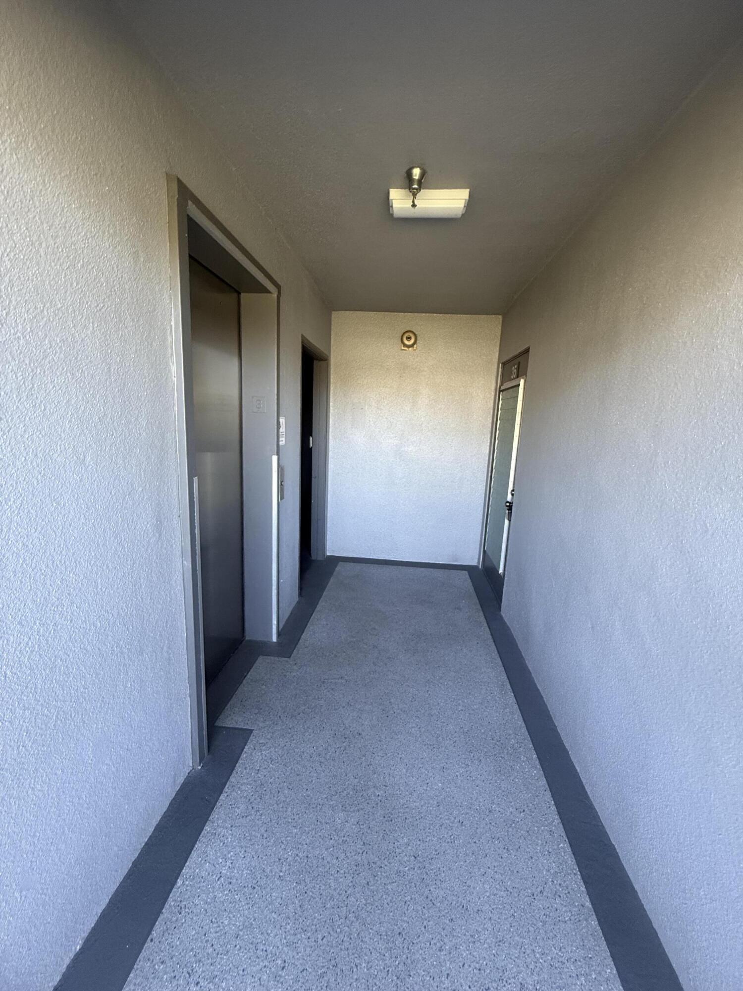 35 Suffolk A, Unit 35 Boca Raton, FL 33434 - Photo 6 of 6 Elevator & Laundry Acrross the Apartment