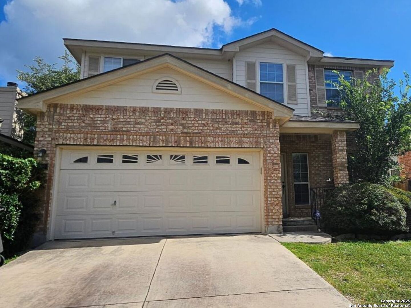 9019 Burnt Peak Helotes, TX 78023 - Photo 1 of 11 a front view of a house with a garden