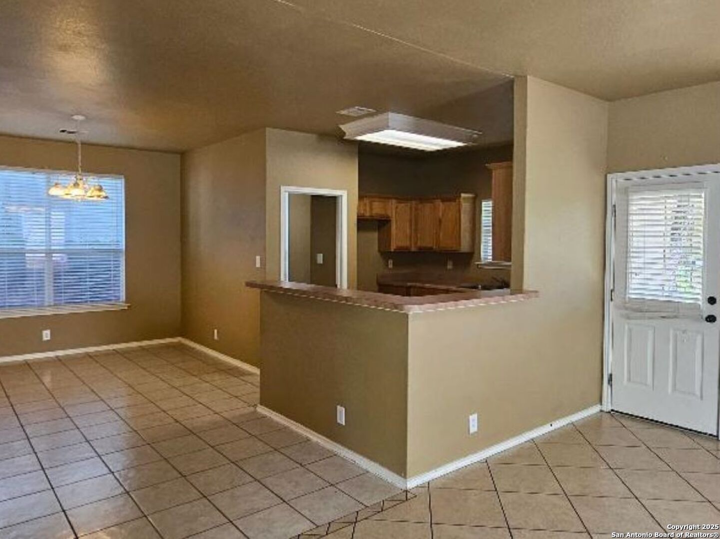 9019 Burnt Peak Helotes, TX 78023 - Photo 2 of 11 a view of a kitchen cabinets and a room