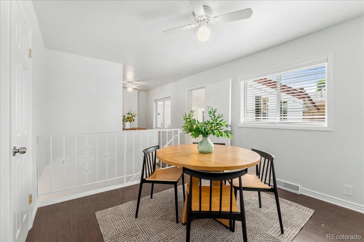 2597 South Perry Street Denver, CO 80219 - Photo 11 of 33 a view of a dining room with furniture and window