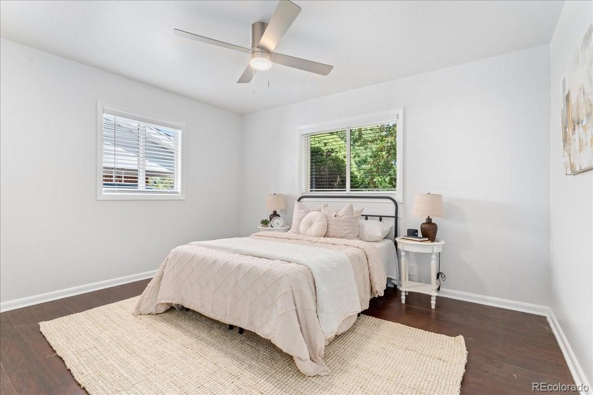 2597 South Perry Street Denver, CO 80219 - Photo 13 of 33 a bedroom with a bed and a window