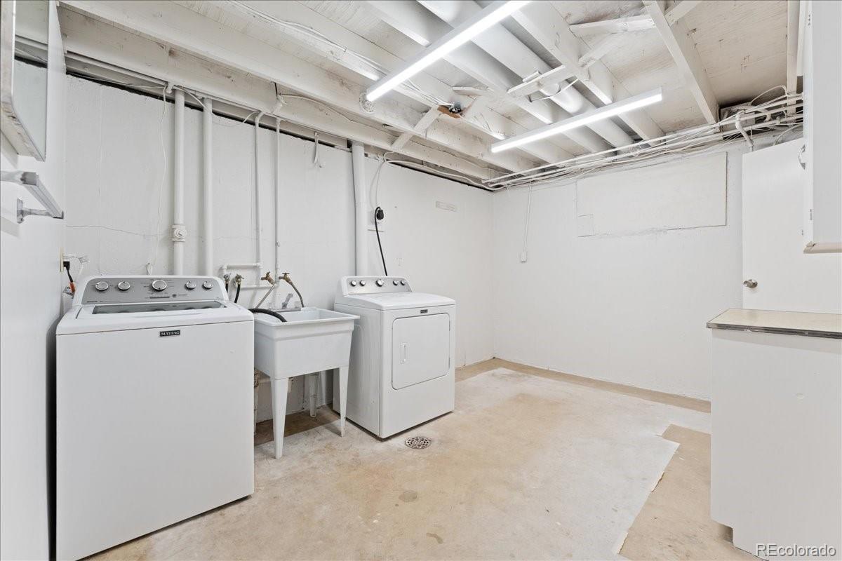 2597 South Perry Street Denver, CO 80219 - Photo 22 of 33 a utility room with dryer and washer