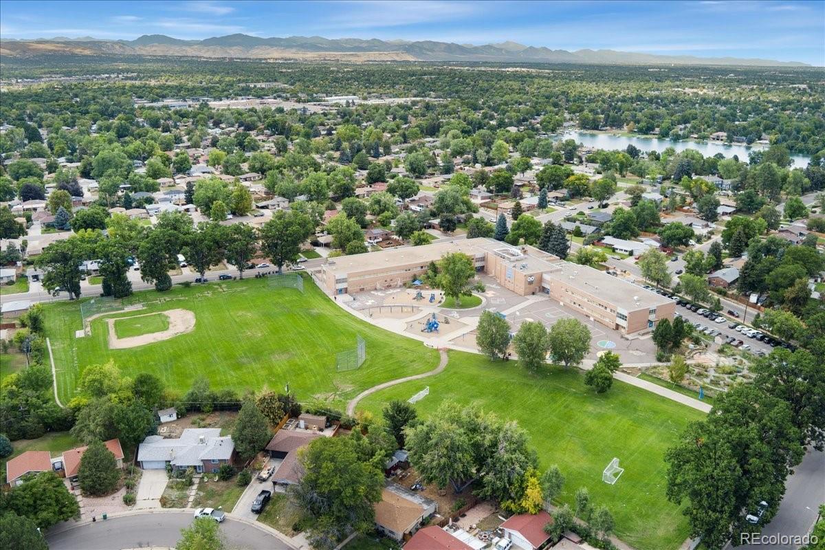 2597 South Perry Street Denver, CO 80219 - Photo 33 of 33 an aerial view of residential houses with outdoor space and trees