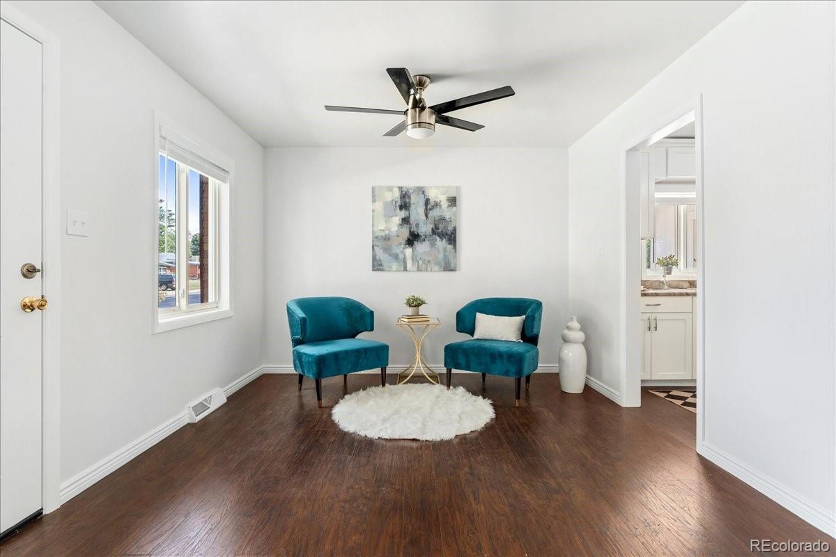 2597 South Perry Street Denver, CO 80219 - Photo 6 of 33 a view of a dining room with furniture window and wooden floor