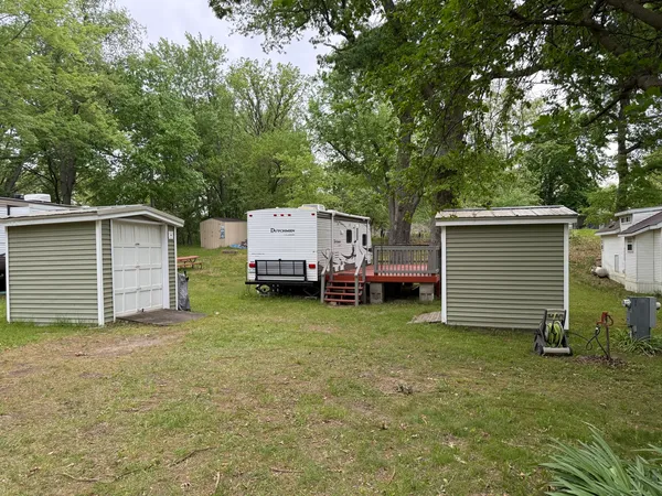 a view of a house with a truck parked in a yard