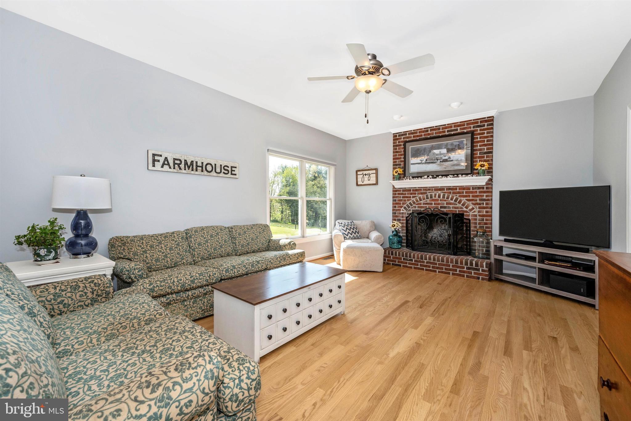 7779 Dollyhyde Road Mount Airy, MD 21771 - Photo 9 of 84 Cozy family room - brick wood burning fireplace.