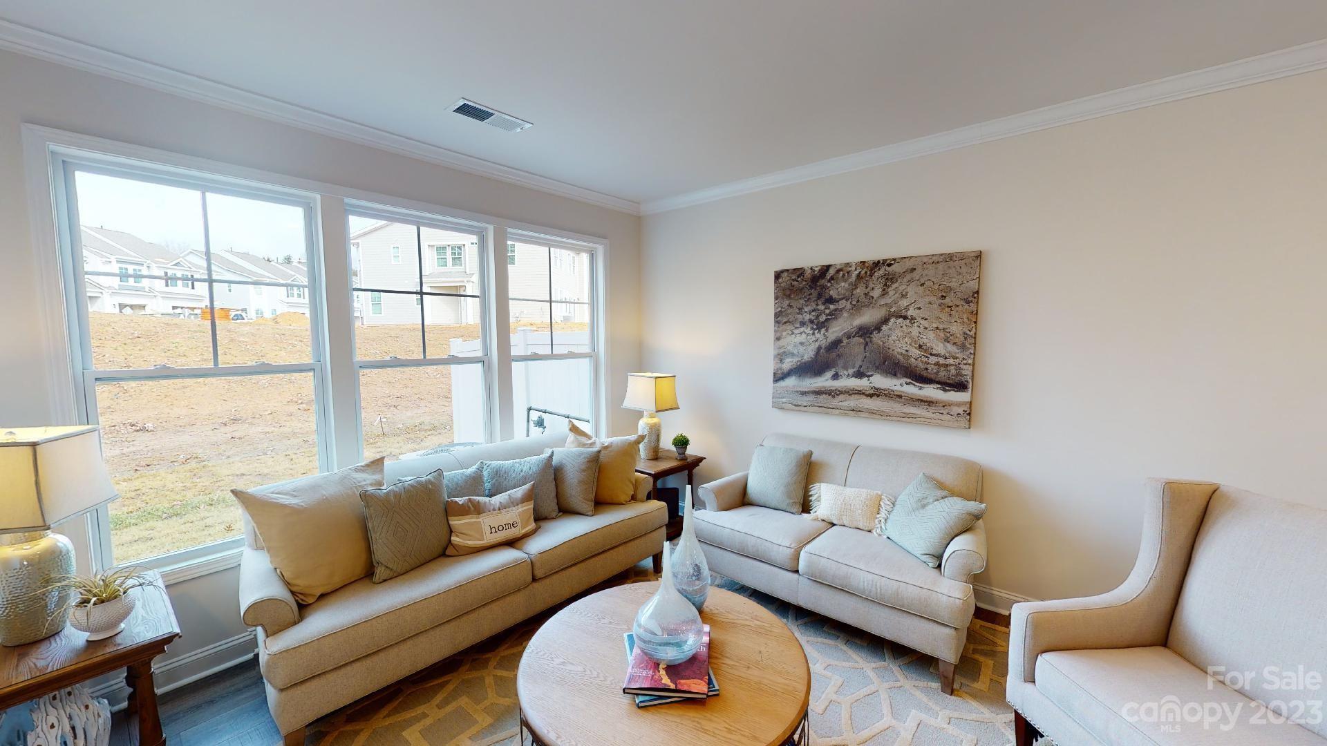 44 Ravens Rdg Road Hendersonville, NC 28792 - Photo 15 of 38 a living room with furniture and a large window