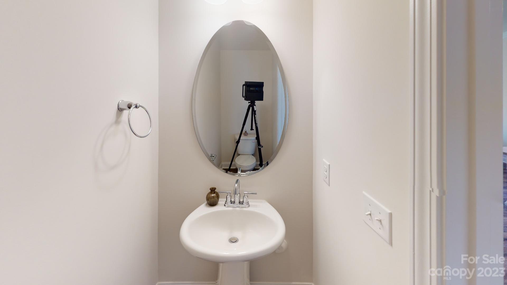 44 Ravens Rdg Road Hendersonville, NC 28792 - Photo 3 of 38 a bathroom with a sink and a mirror