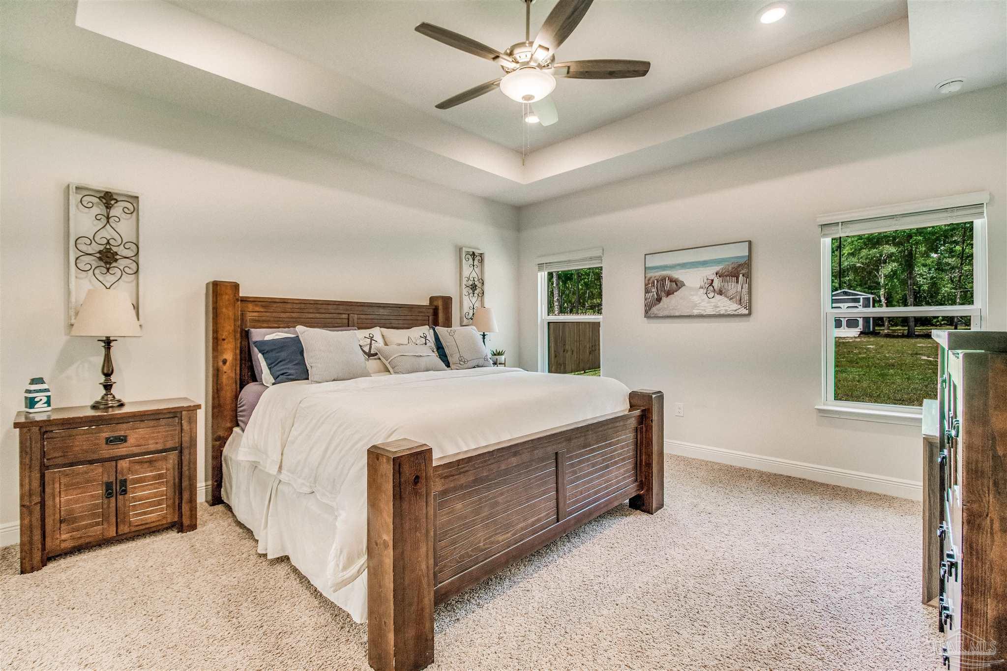 8024 Silver Maple Drive Milton, FL 32583 - Photo 15 of 43 a bedroom with a bed and a window