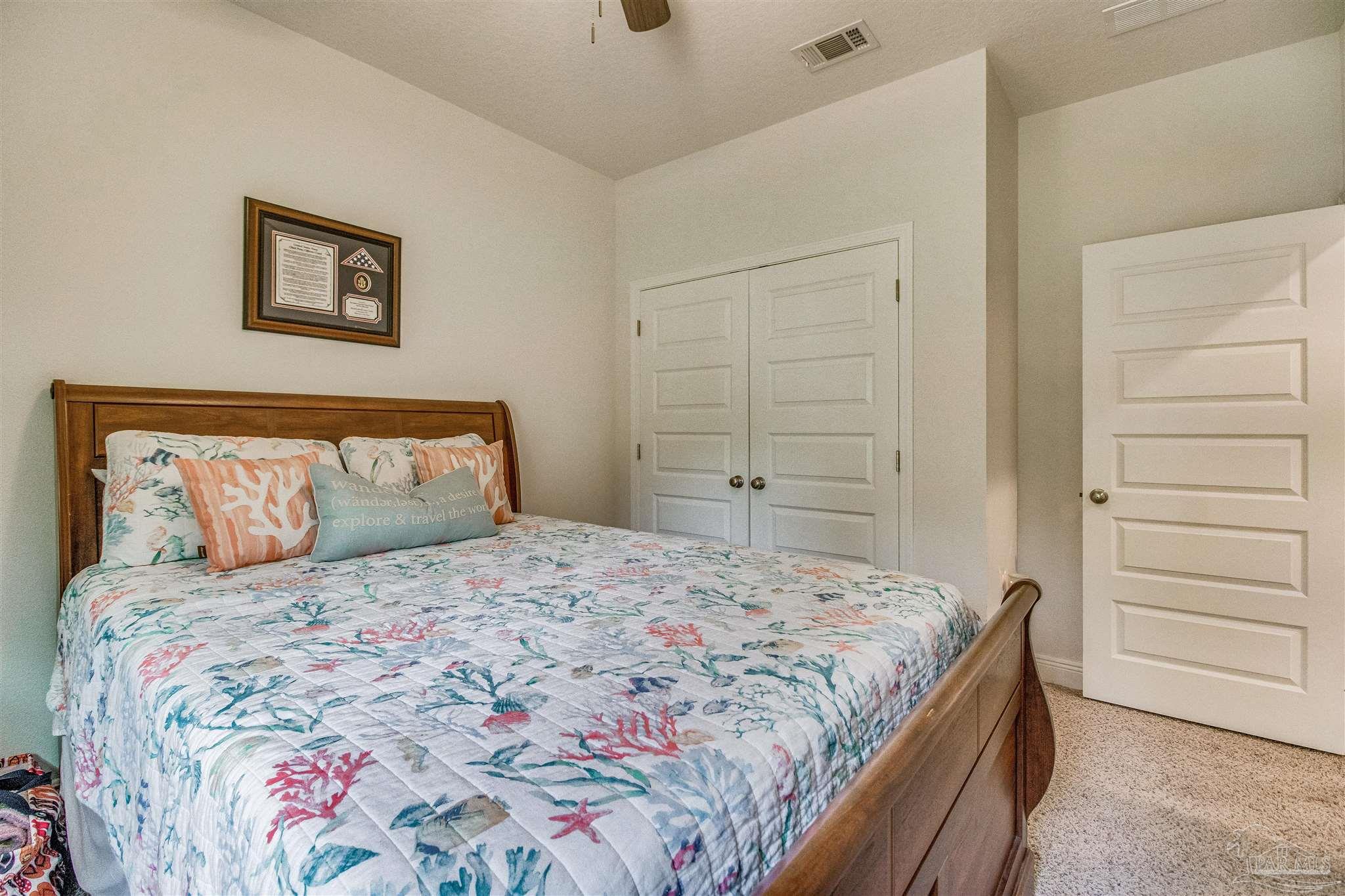 8024 Silver Maple Drive Milton, FL 32583 - Photo 28 of 43 a bedroom with a bed and a closet