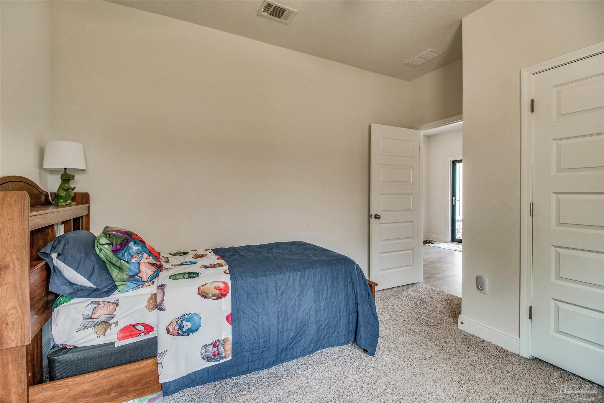 8024 Silver Maple Drive Milton, FL 32583 - Photo 33 of 43 a bedroom with a bed and closet