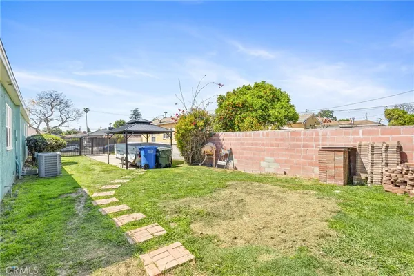 a view of a house with a yard and a garage