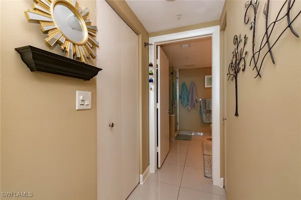 a view of a hallway with entryway door