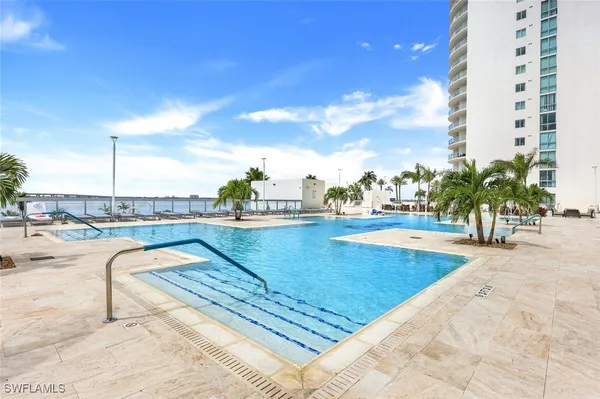 a view of swimming pool with outdoor seating