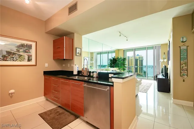 a dining hall with granite countertop a sink and cabinets