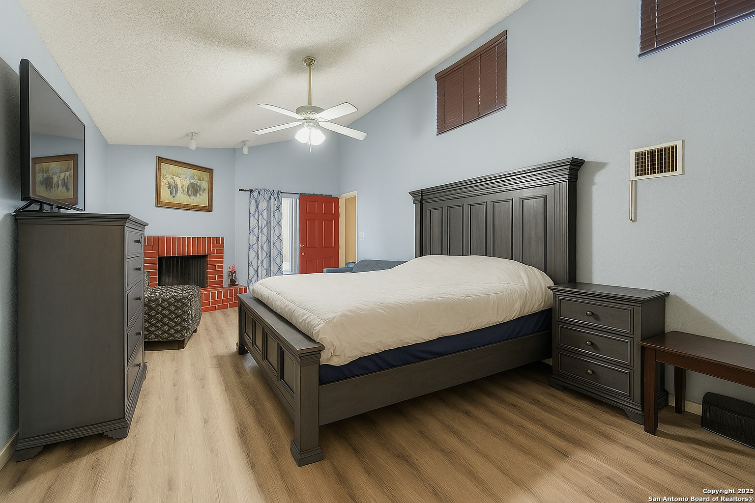 2518 Ridge Leaf San Antonio, TX 78251 - Photo 12 of 19 a bedroom with a bed dresser and a flat tv screen